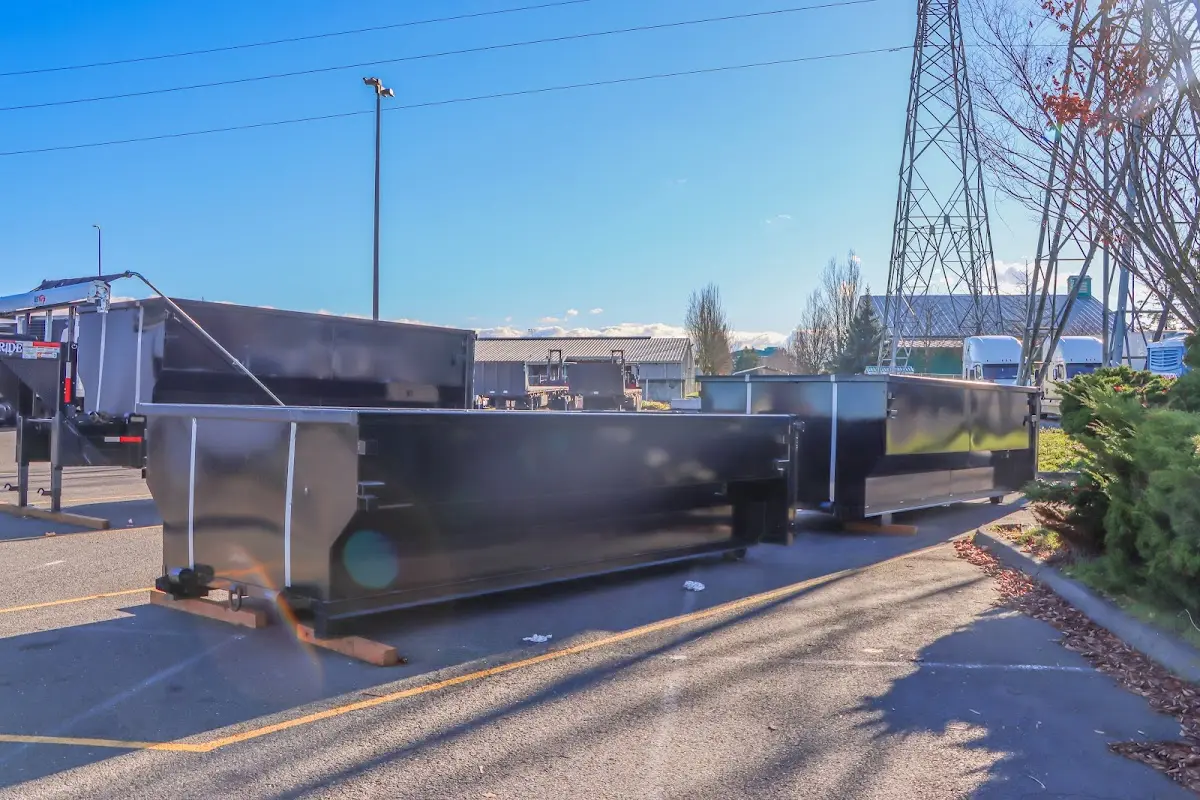 Roll-off dumpster ready for waste disposal at job site for 15 Yard Dumpster Rental in Sinton